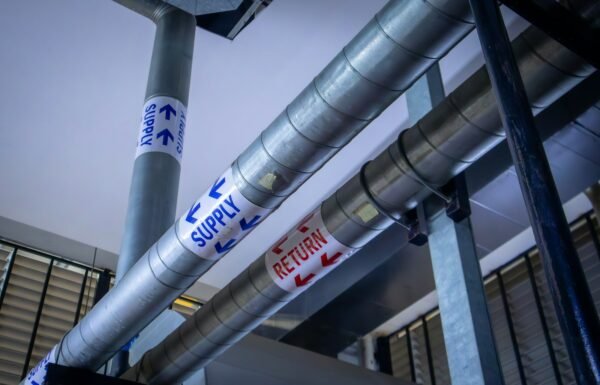 a metal pole with a bunch of signs on it